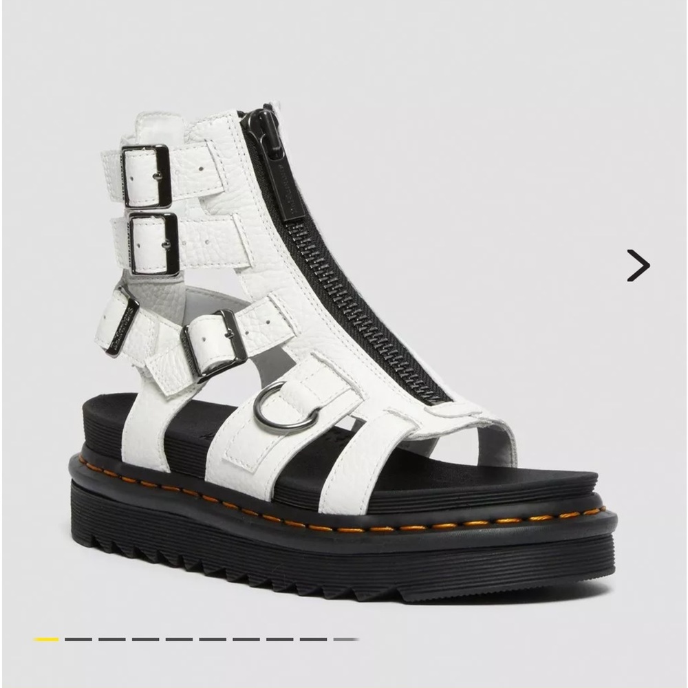 Women’s Dr. Martens white leather front zip sandal.